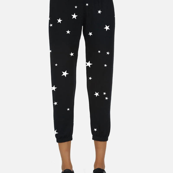 White sweatpants with online black stars